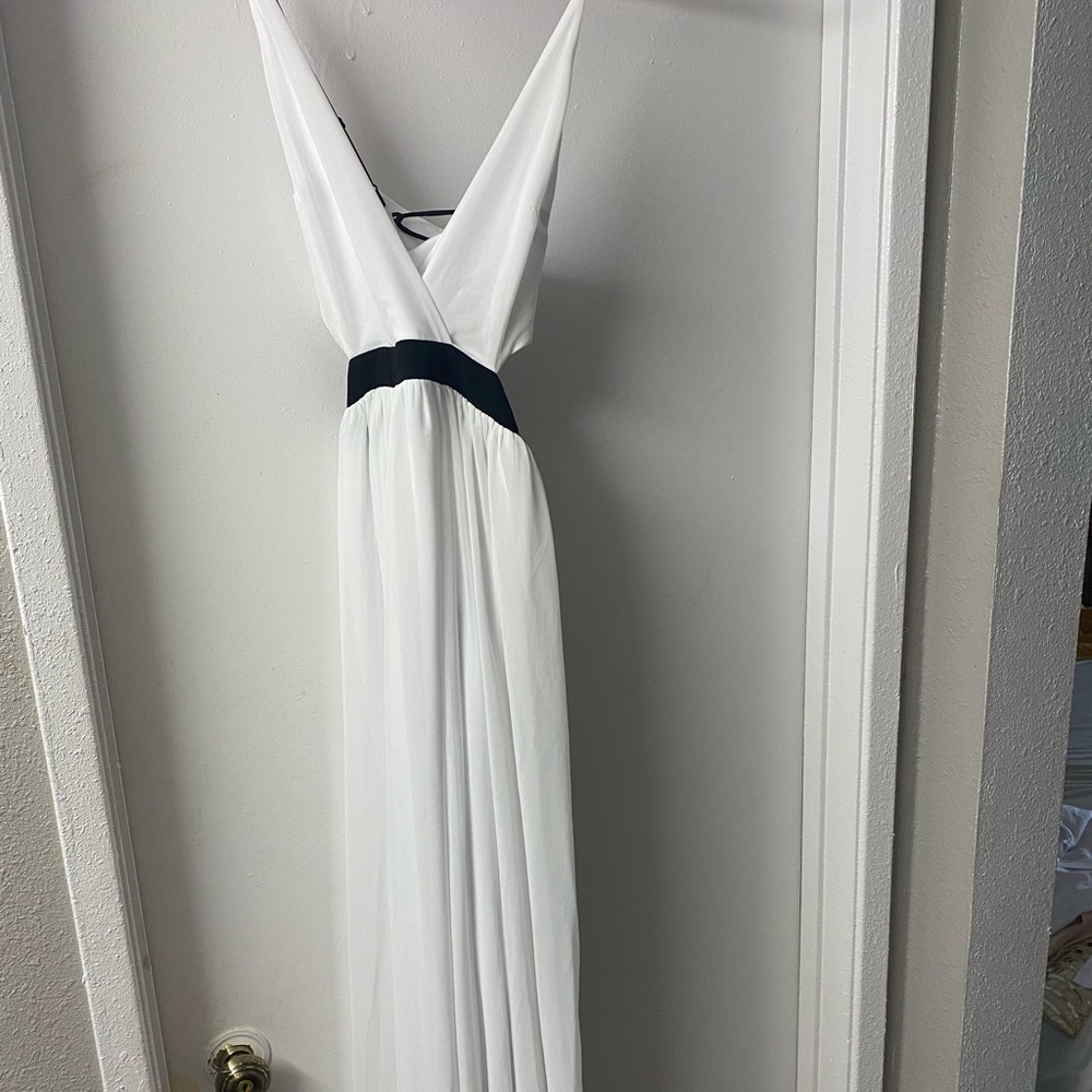 White formal gown, waist and back open. Full length.